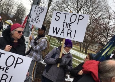 Crowd with stop the war signs